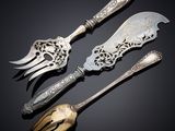 three pieces of silverware including a knife, fork and spoon
