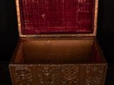an old wooden chest with a red velvet lining and a red velvet lining
