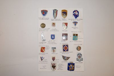 a picture of a wall with a bunch of badges on it