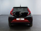 a close up of the rear end of a black and red toyota c - hr