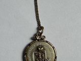 an image of a coin that is on a chain