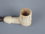 a pipe that is sitting on a table with a handle