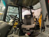 a tractor that is parked inside of a building