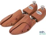 two pairs of wooden shoes are sitting on top of each other