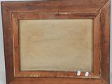 an old wooden picture frame with a small piece of paper in it