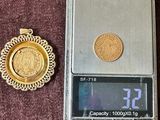 a small scale with a coin on it next to a coin