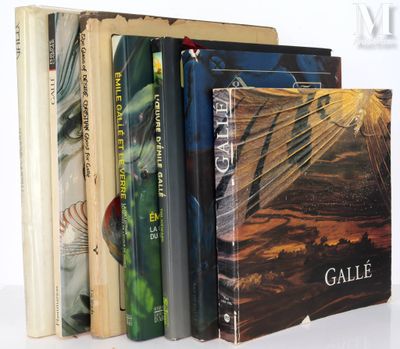 a lot of books that are stacked on top of each other