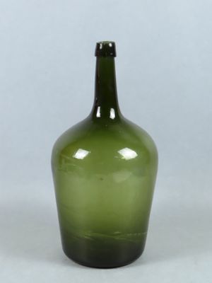 an image of a green glass bottle on a white background
