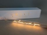 a white box with a light that says i love you next to it