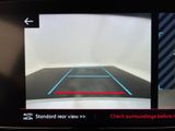 a picture of a car ' s rear view mirror with a red line on it