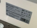 a label on the side of a machine that is sitting on the ground