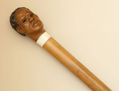 CANNE en jonc de Malacca Pommeau en bois sculpté d'une tête … - Photo 1