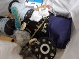 a pile of luggage and other items in a plastic bag