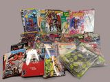 a lot of comic books that are on the table