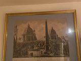 a picture hanging on the wall of a living room