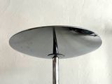 a close up of a table with a mirror on top of it