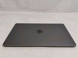 an apple macbook pro laptop computer sitting on top of a white surface