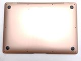 the back side of a laptop with a metal plate on it