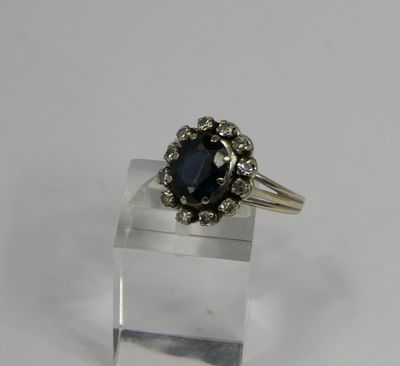 a close up of a ring on a clear surface with a white background