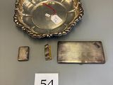 a silver plate with a number on it next to a lighter