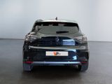 the rear end of a black car in a white room