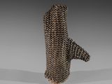 a close up of a metal object on a white surface