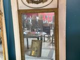 two mirrors sitting next to each other in a room