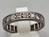 a white gold ring with diamonds set in the center