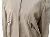 a white jacket with zippers and a collar on a mannequin mannequin mannequin mannequin mannequin mannequin mannequin