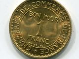 l'image d'une pièce d'or sur laquelle figure l'image d'un homme