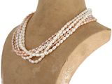 three strand pearl necklace on a mannequin display