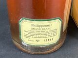 a jar of honey sitting next to a jar of honey