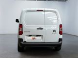 a white van that is parked in a room