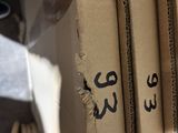a stack of cardboard boxes with arabic writing on them