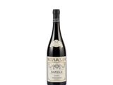 a bottle of wine sitting on top of a white surface