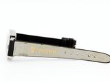 a close up of a watch strap on a white surface
