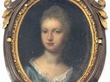 portrait d'une femme en robe bleue dans un cadre doré