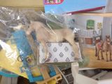 a toy horse in a plastic bag on a table