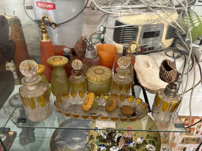 a glass table with a lot of glass items on it