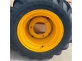 a close up of a tractor tire with a yellow rim