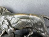 a statue of a lion that is on a table