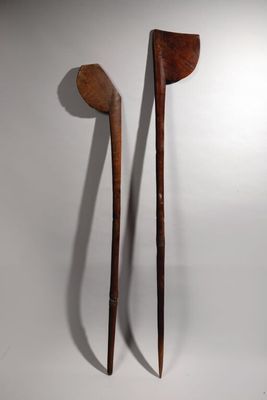 pair of wooden spoons on a white background