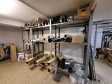 a room with a lot of shelves and boxes on it