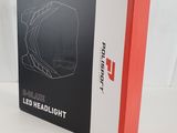 the box is open on a white surface with a black and red design