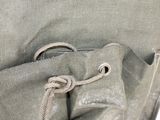 a close up of a bag with a rope in it