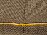 a close up of a brown box with a yellow line on it