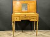 a wooden desk with a mirror on top of it