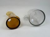two empty wine glasses sitting next to each other on a table