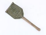 a wooden spatula with a green cover on top of it
