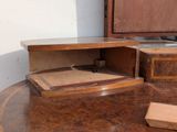 a wooden desk with a drawer on top of it